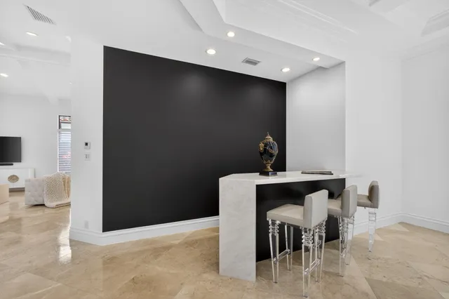 a spacious bathroom with a double vanity sink a mirror a bathtub and shower