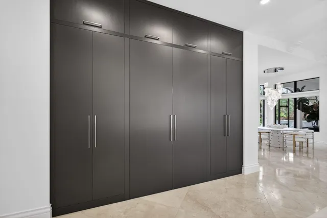 a living room with couches a coffee table and four couches with outer view