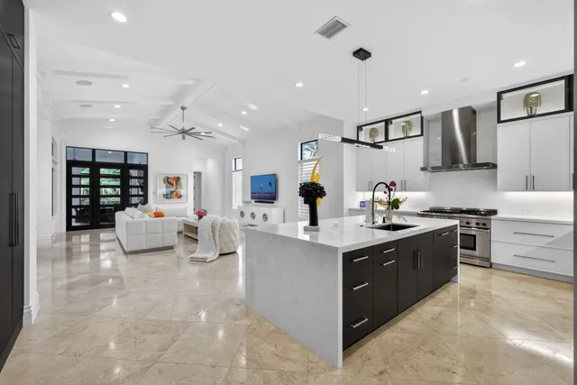 a view of a dining room with furniture and a potted plant