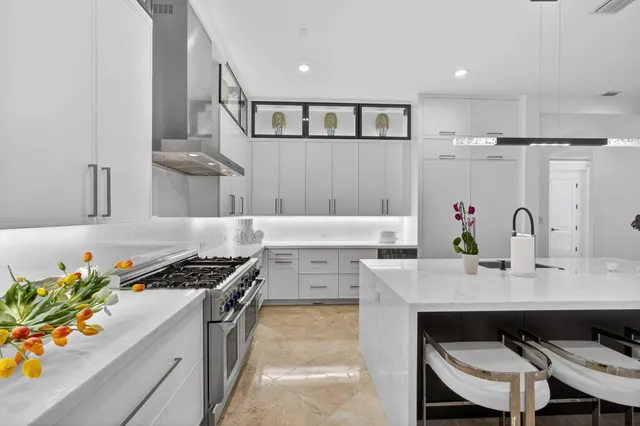 a view of a garden with a slide and potted plants
