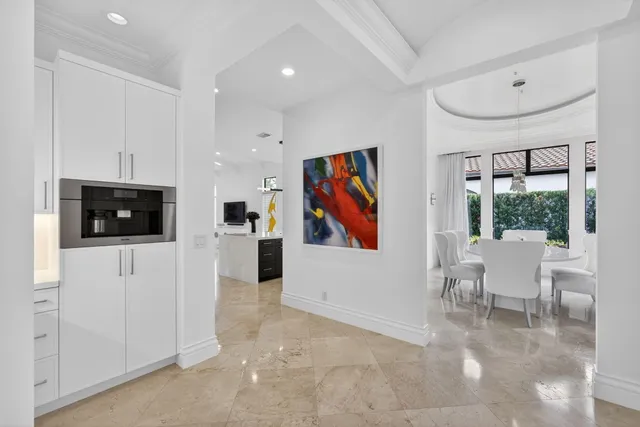 an aerial view of a house with yard and mountain view in back