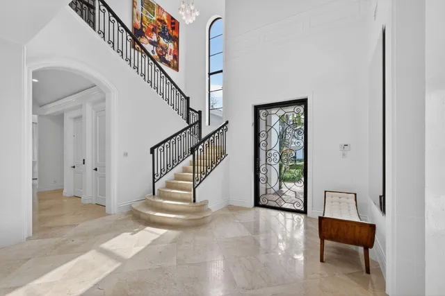 a living room with stainless steel appliances kitchen island furniture and a window