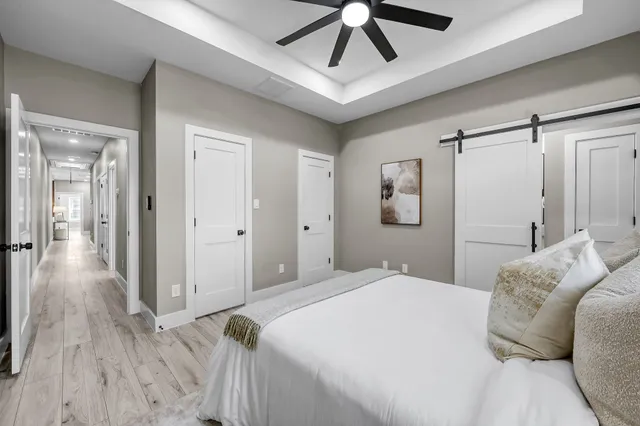 a kitchen with stainless steel appliances a sink a stove and a wooden floors