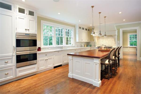 33 Kingsbury Road Newton, MA 02467 - Photo 3 of 12 a kitchen with stainless steel appliances granite countertop a sink a stove and a wooden floors