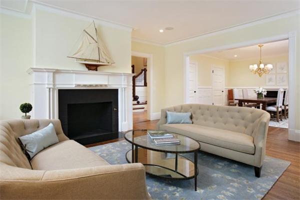 33 Kingsbury Road Newton, MA 02467 - Photo 6 of 12 a living room with furniture a fireplace and a chandelier