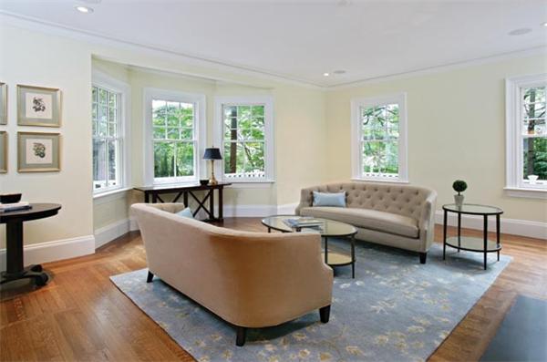 33 Kingsbury Road Newton, MA 02467 - Photo 7 of 12 a living room with couches and a potted plant next to a window