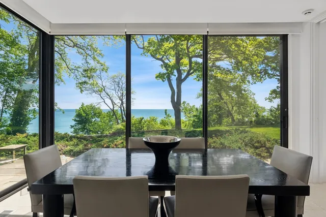 a view of a dining room with furniture window and outside view
