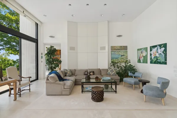 a living room with furniture and flowers