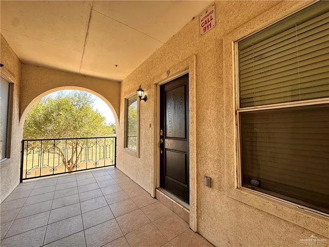 a view of entryway with a door and wooden floor