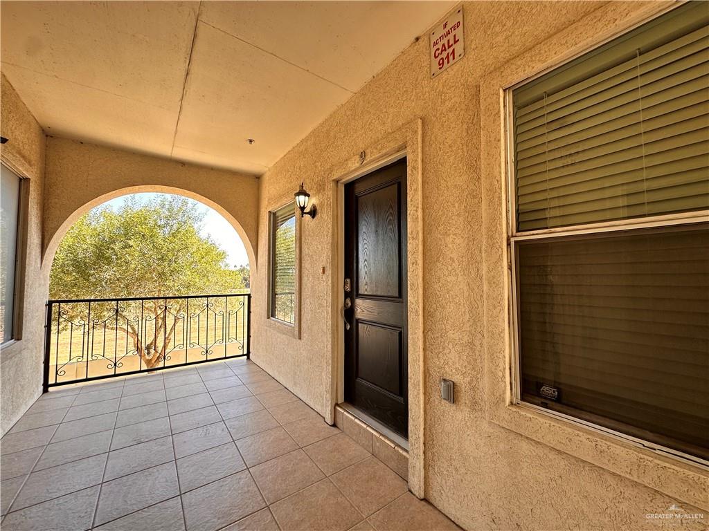 a view of entryway with a door and wooden floor