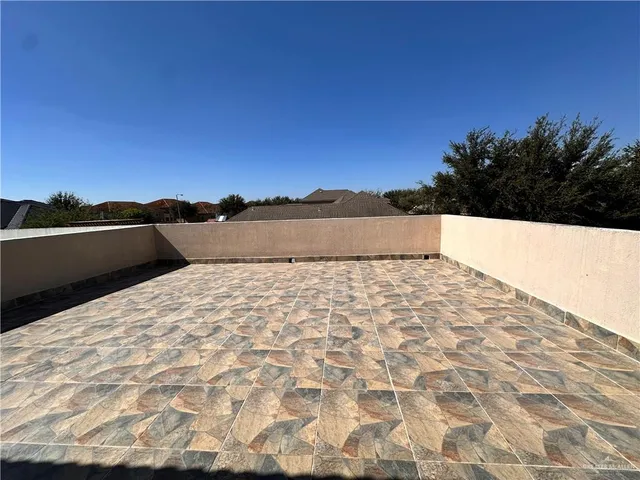 a view of wooden floor and a mountain in the background