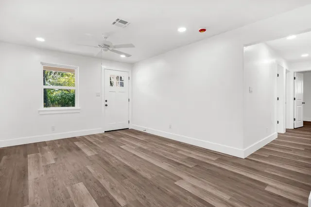 a kitchen with refrigerator and window