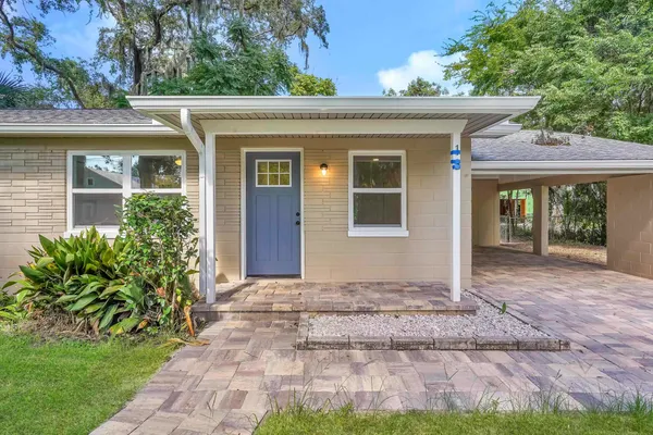 front view of a house with a yard