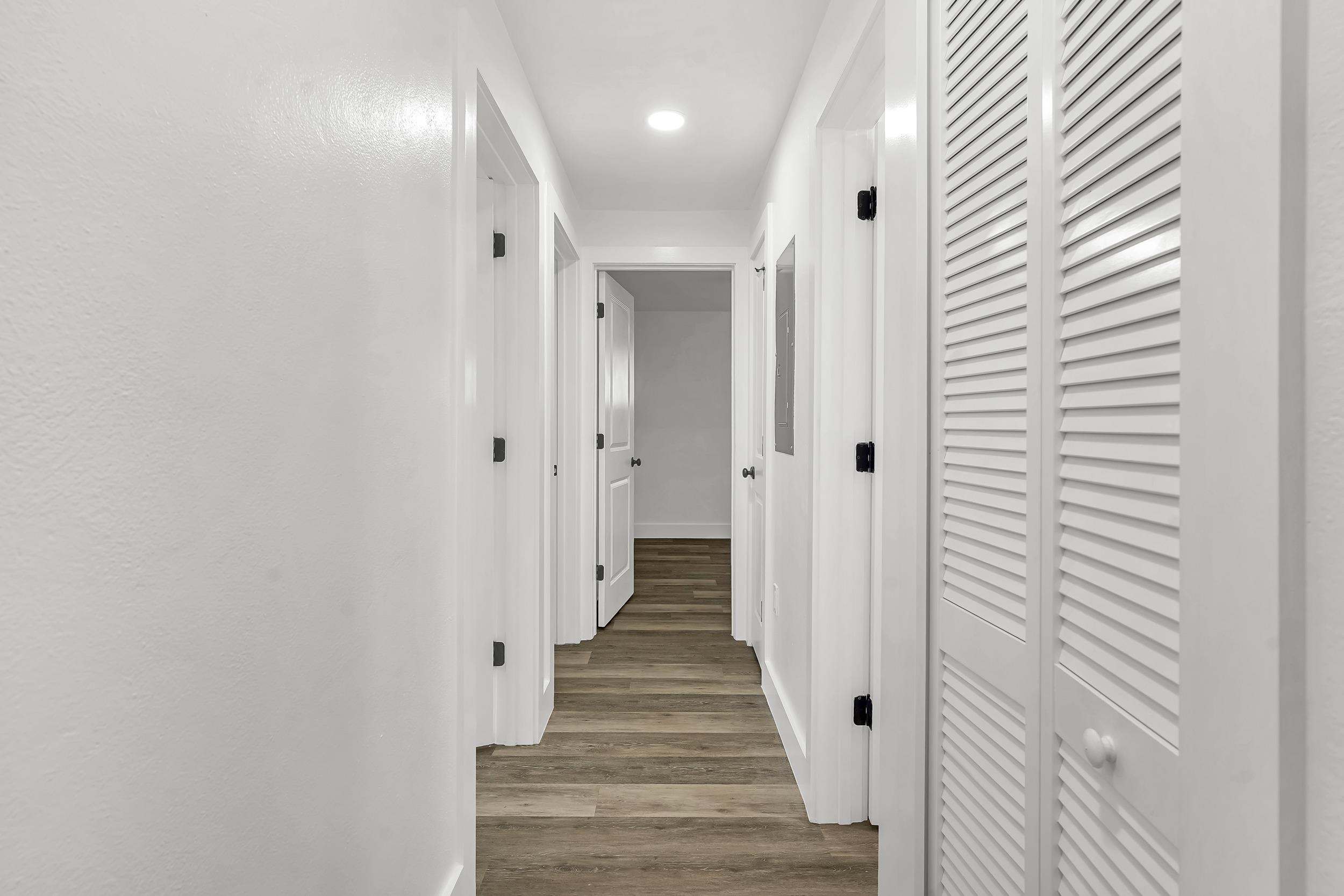 13 Oak Street St. Augustine, FL 32084 - Photo 24 of 39 a view of a hallway with wooden floor and staircase