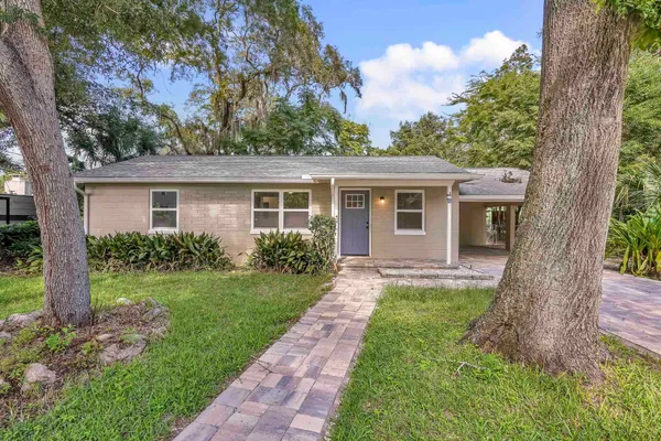 a view of a house that has a garden