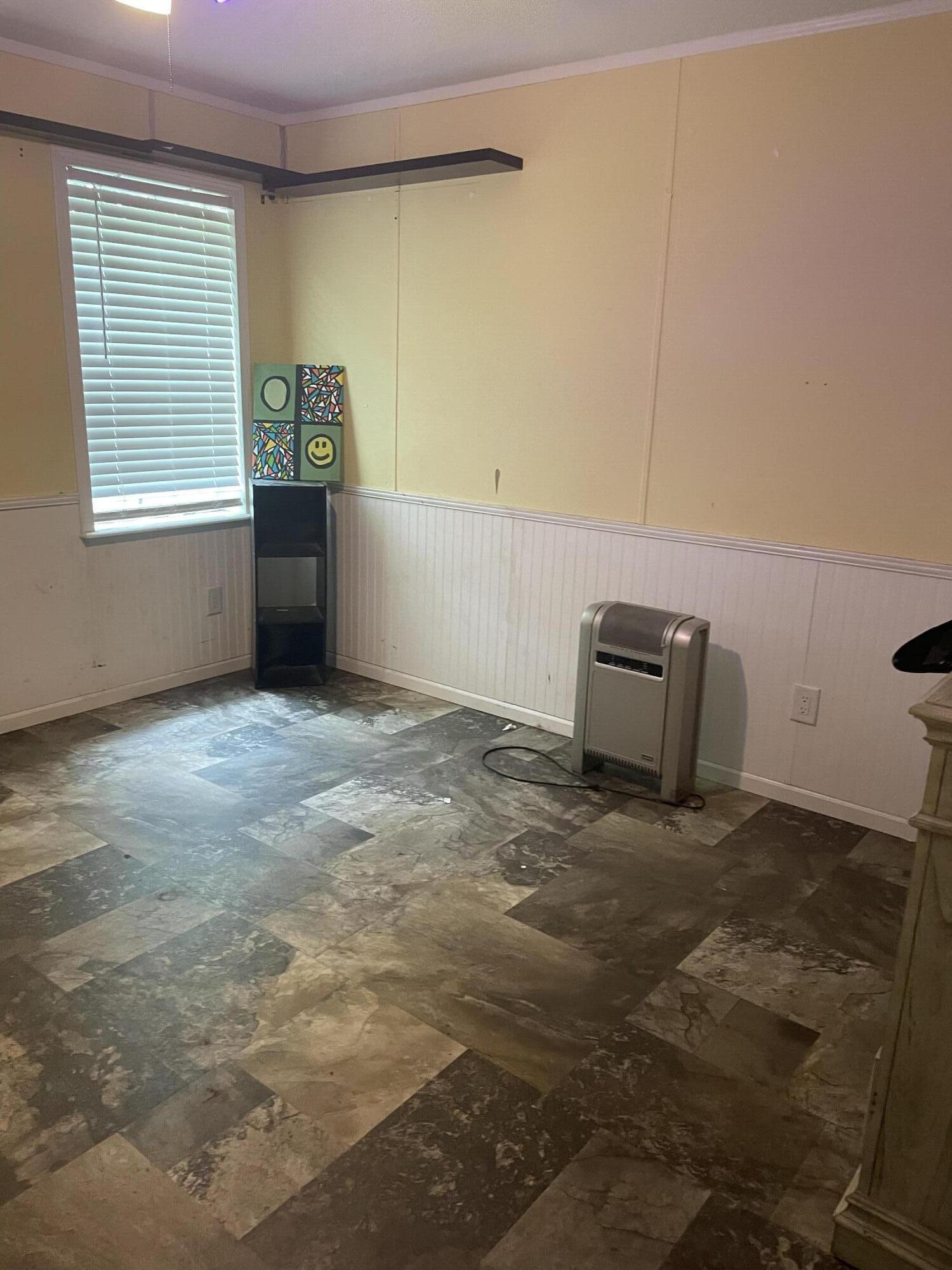 1412 Cape Lane Niceville, FL 32578 - Photo 14 of 23 a view of room with window and wooden floor