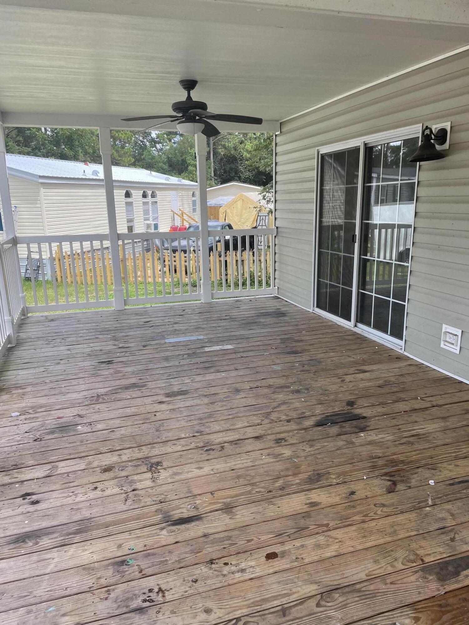 1412 Cape Lane Niceville, FL 32578 - Photo 3 of 23 a front view of a house having yard