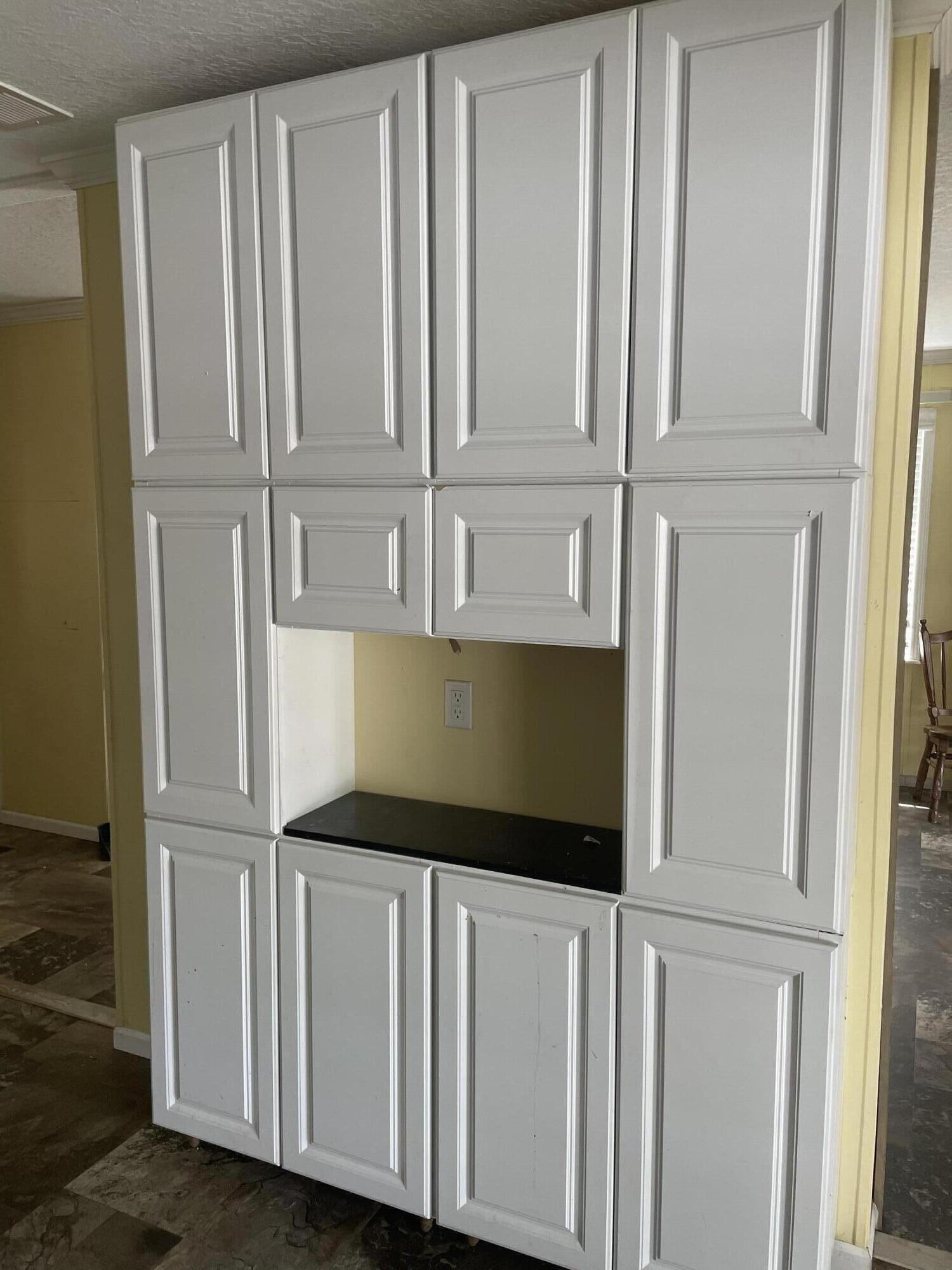 1412 Cape Lane Niceville, FL 32578 - Photo 5 of 23 a view of a closet with white cabinets