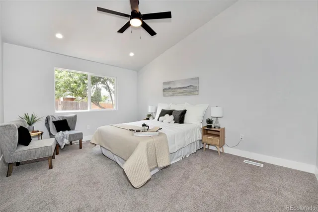 a bed room with bed and window