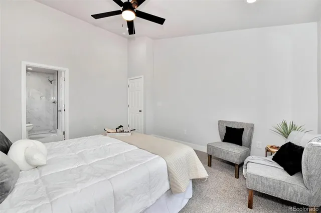 a bedroom with a bed and couch