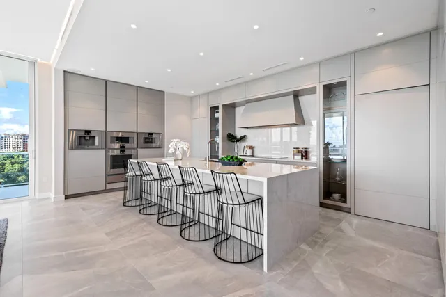 a dining room with a table and chandelier