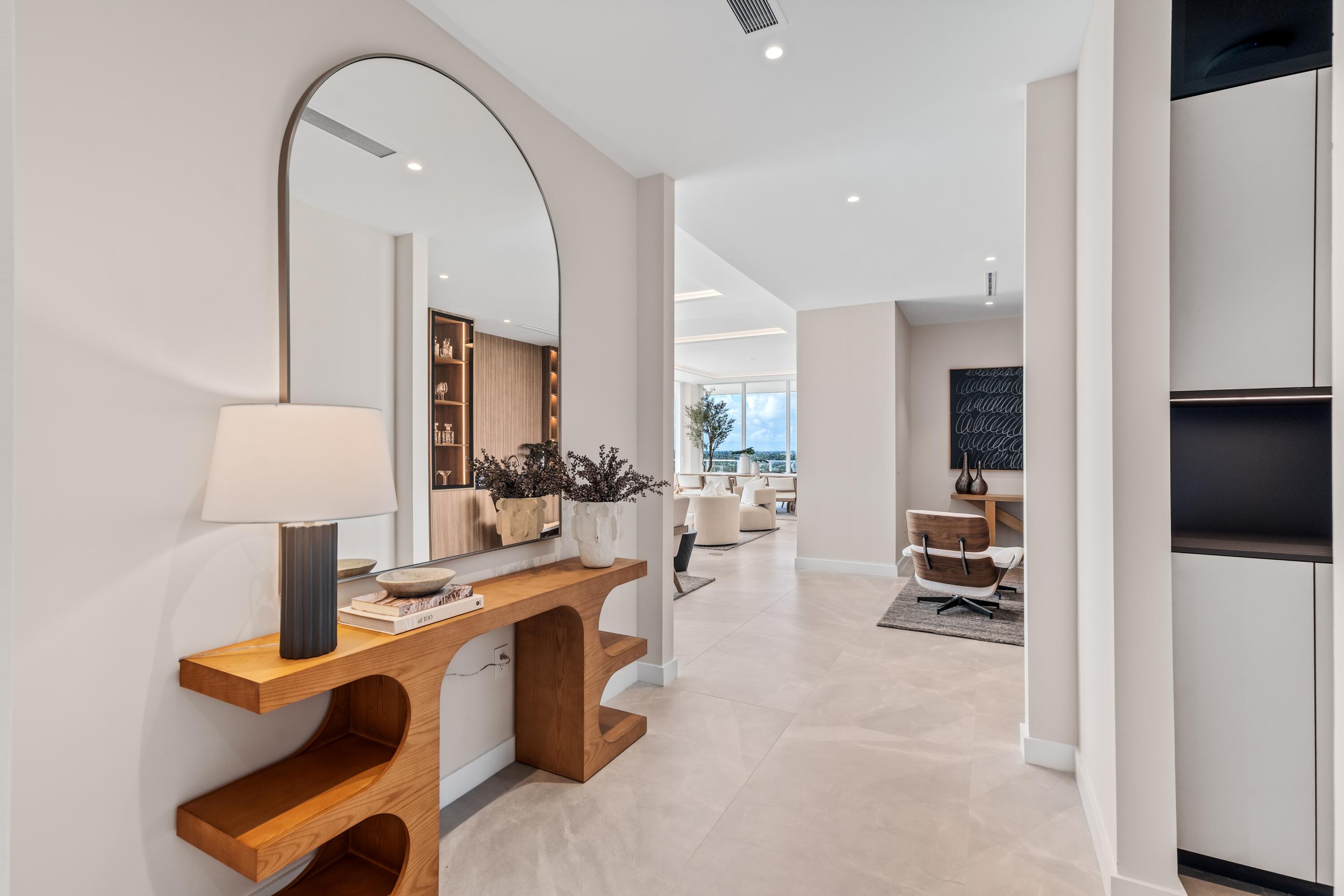 220 Southeast Mizner Boulevard, Unit PH24 Boca Raton, FL 33432 - Photo 15 of 51 a view of living room filled with furniture and a lamp