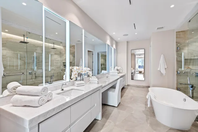 a bathroom with a bathtub and a shower