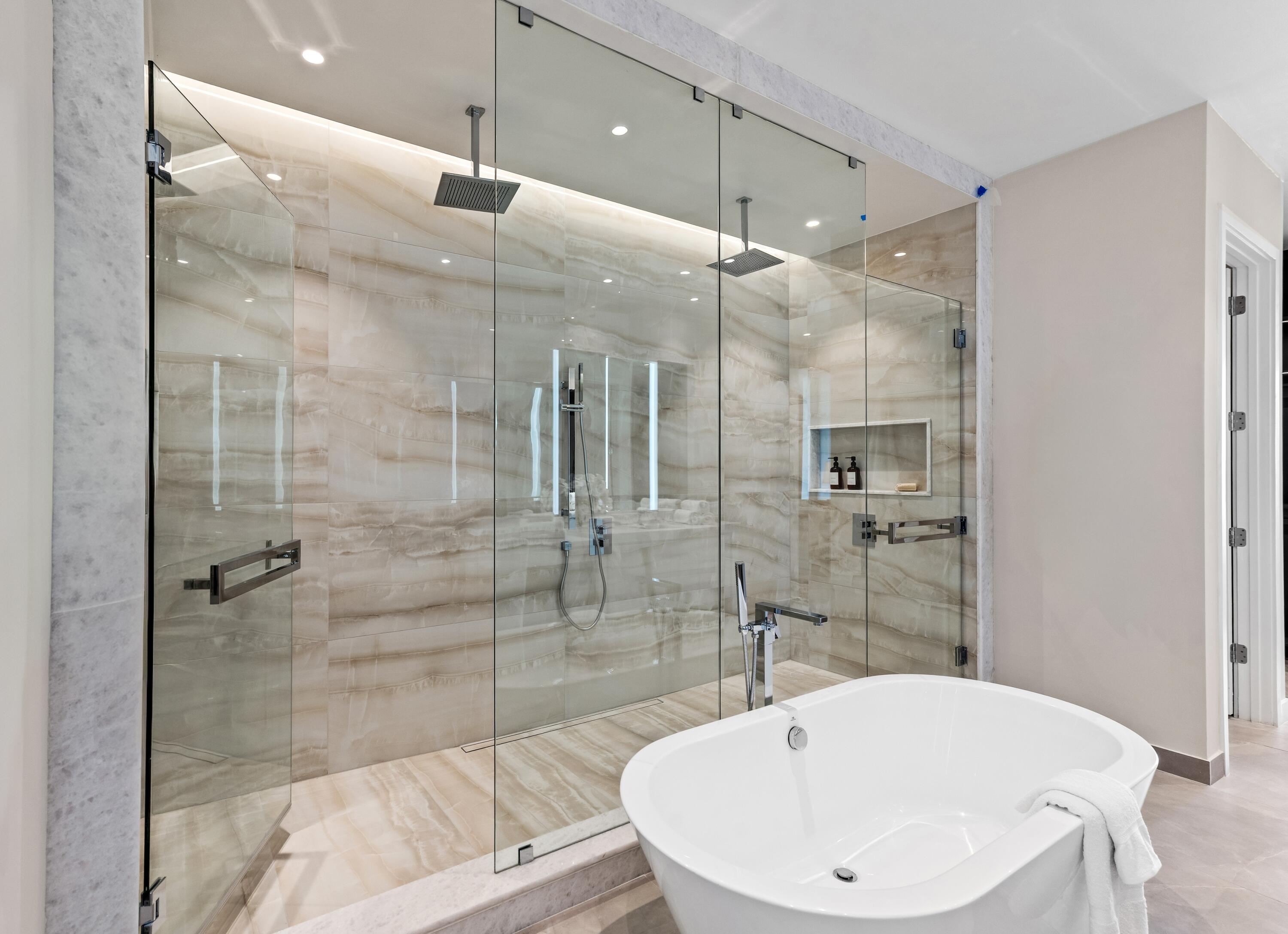 220 Southeast Mizner Boulevard, Unit PH24 Boca Raton, FL 33432 - Photo 20 of 51 a bathroom with a bathtub and a shower