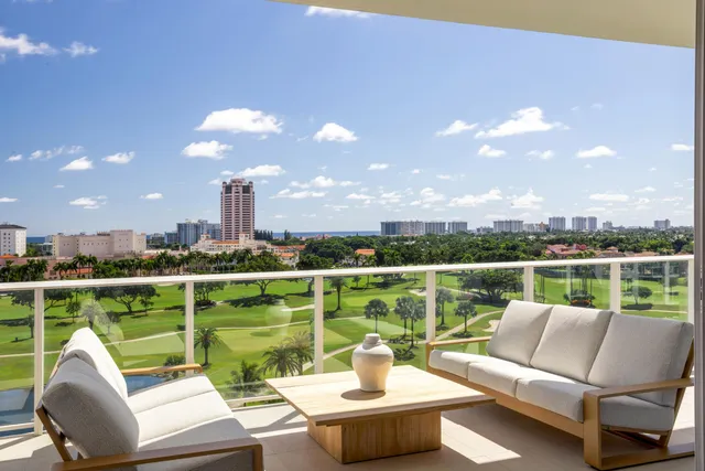 a view of a terrace with couches and city view