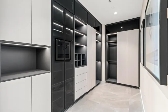 a bedroom with bed and a potted plant