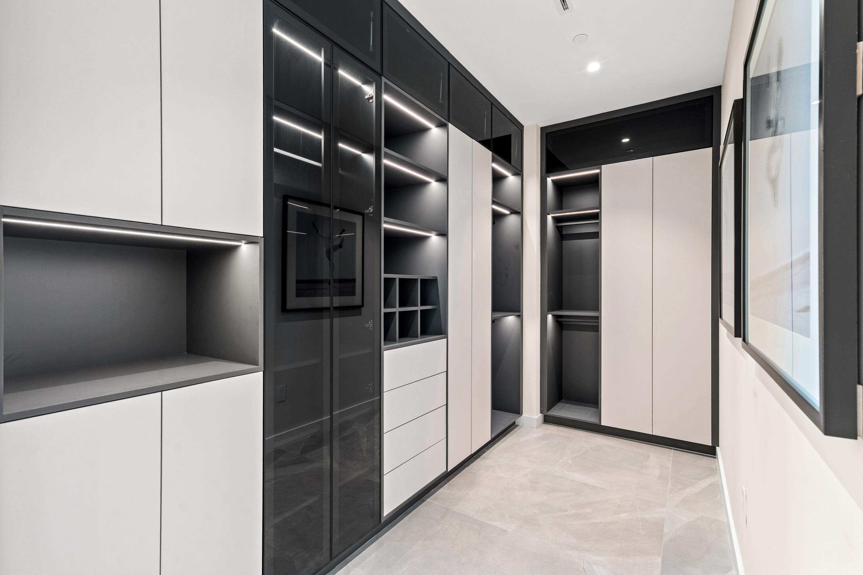 220 Southeast Mizner Boulevard, Unit PH24 Boca Raton, FL 33432 - Photo 21 of 51 a view of walk in closet with empty racks