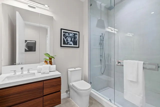 a bedroom with furniture and a large window