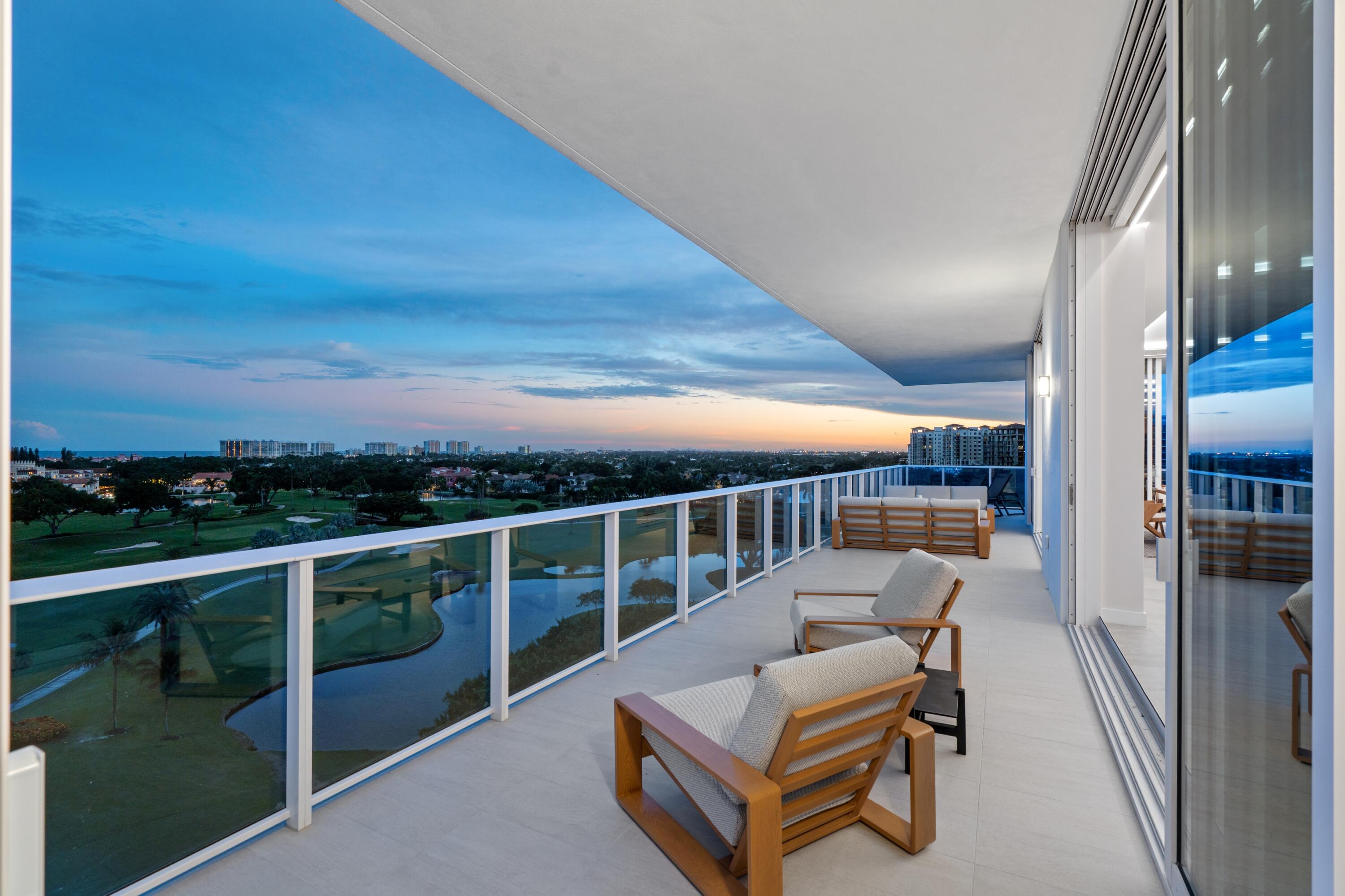220 Southeast Mizner Boulevard, Unit PH24 Boca Raton, FL 33432 - Photo 27 of 51 a view of a balcony with chair and table