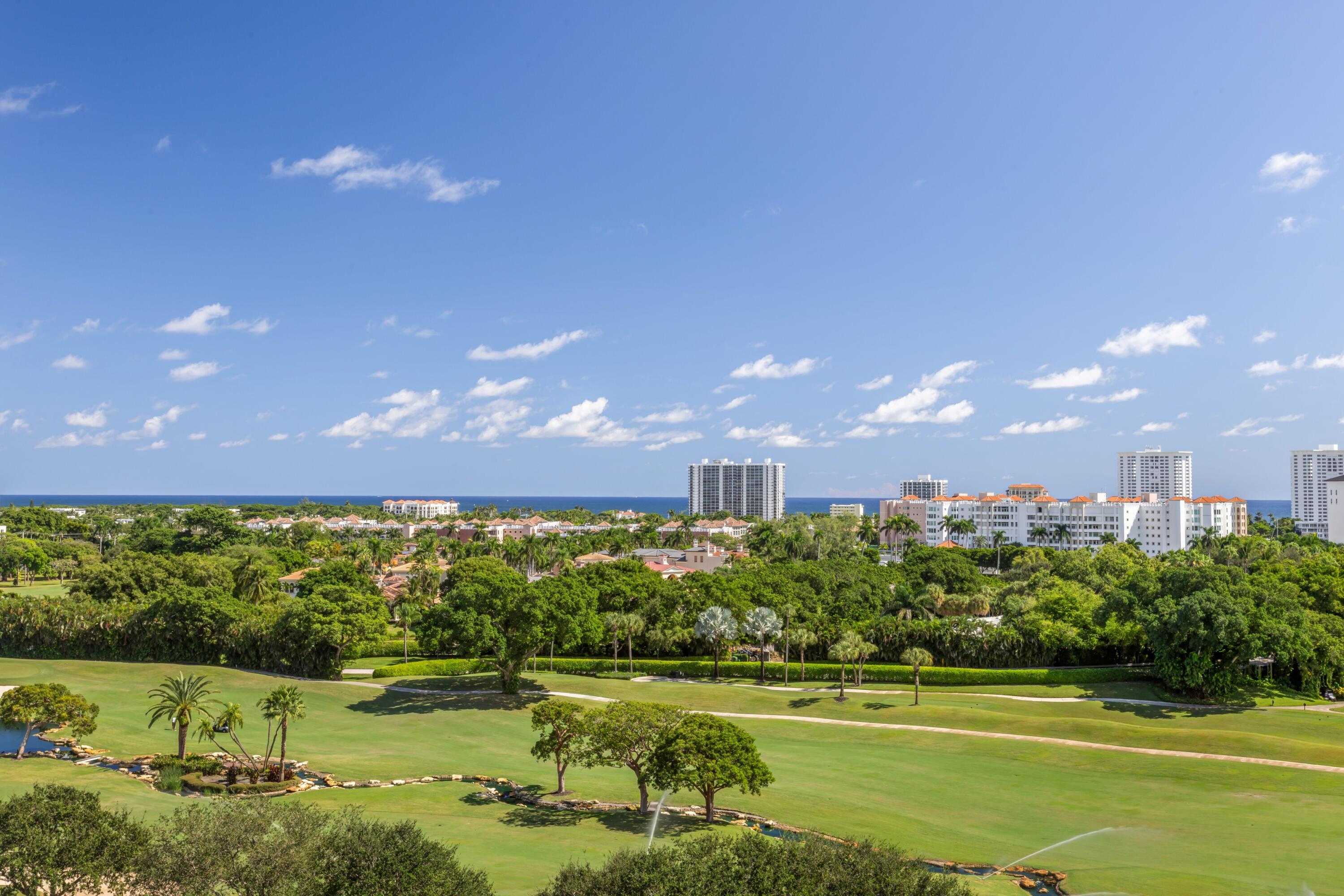 220 Southeast Mizner Boulevard, Unit PH24 Boca Raton, FL 33432 - Photo 35 of 51 a view of a golf course with a lake