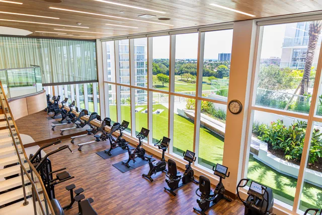 a large room with lots of furniture and mirrors