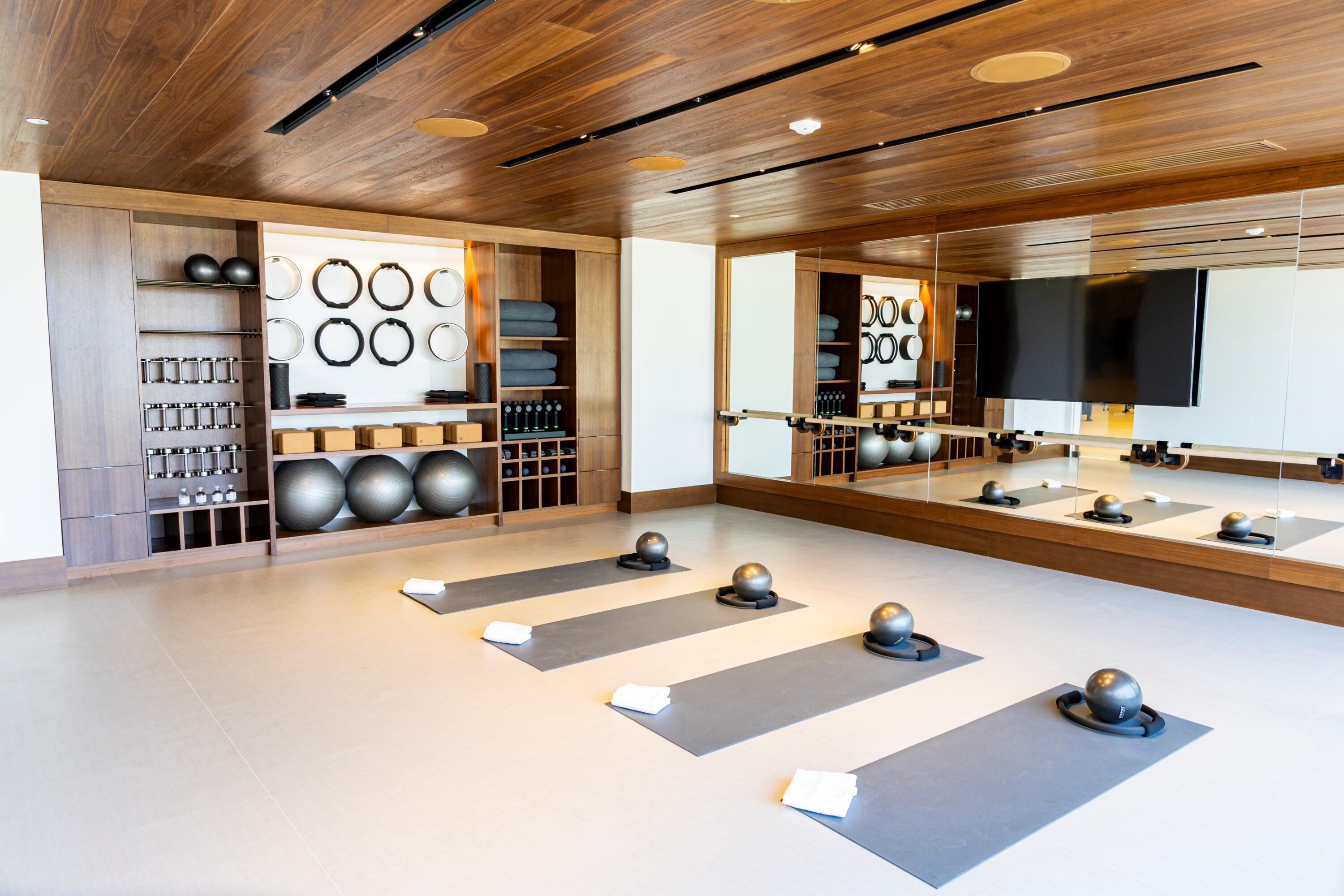 220 Southeast Mizner Boulevard, Unit PH24 Boca Raton, FL 33432 - Photo 45 of 51 a large room with lots of furniture and mirrors