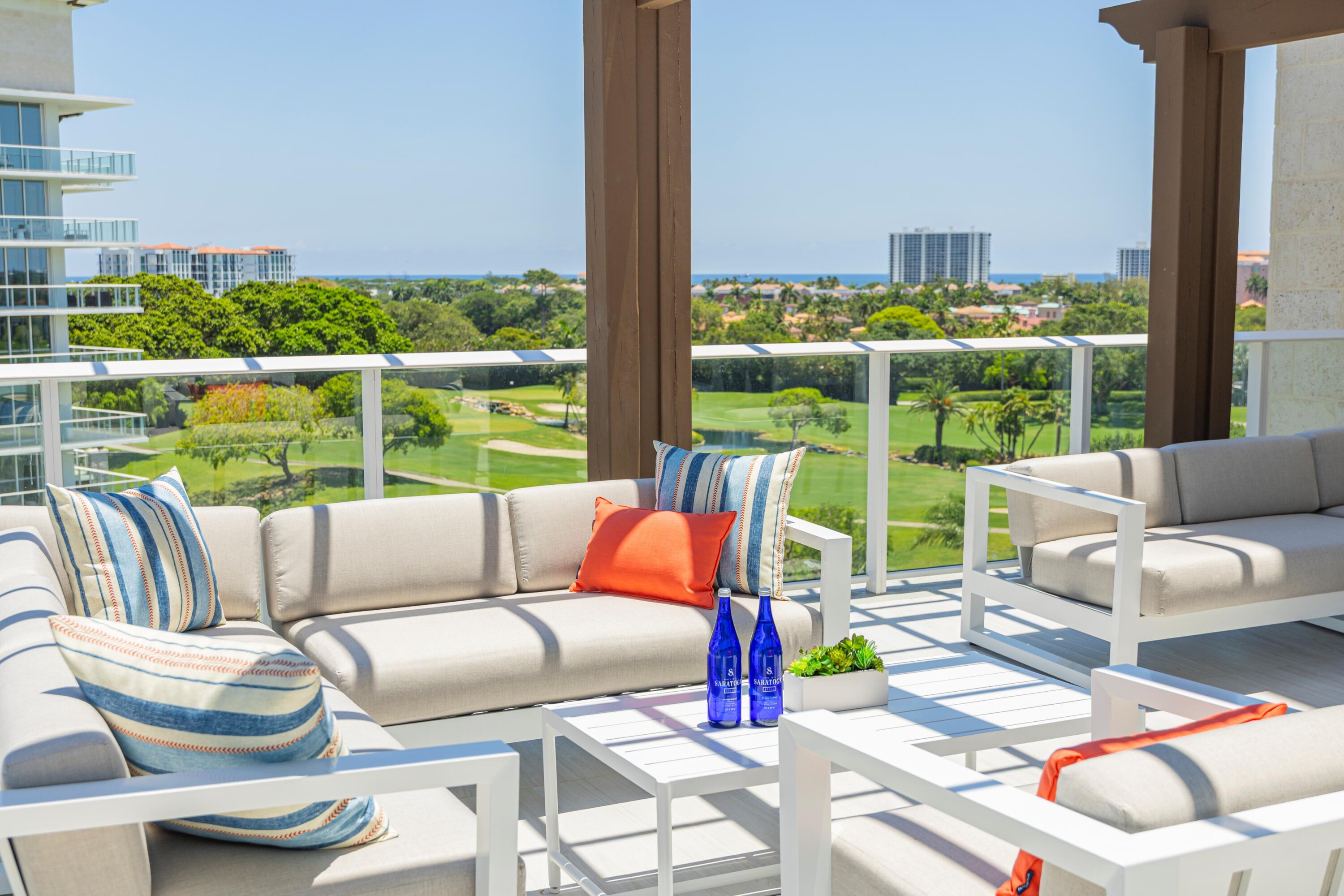220 Southeast Mizner Boulevard, Unit PH24 Boca Raton, FL 33432 - Photo 50 of 51 a view of a patio with couches chairs and a floor to ceiling window