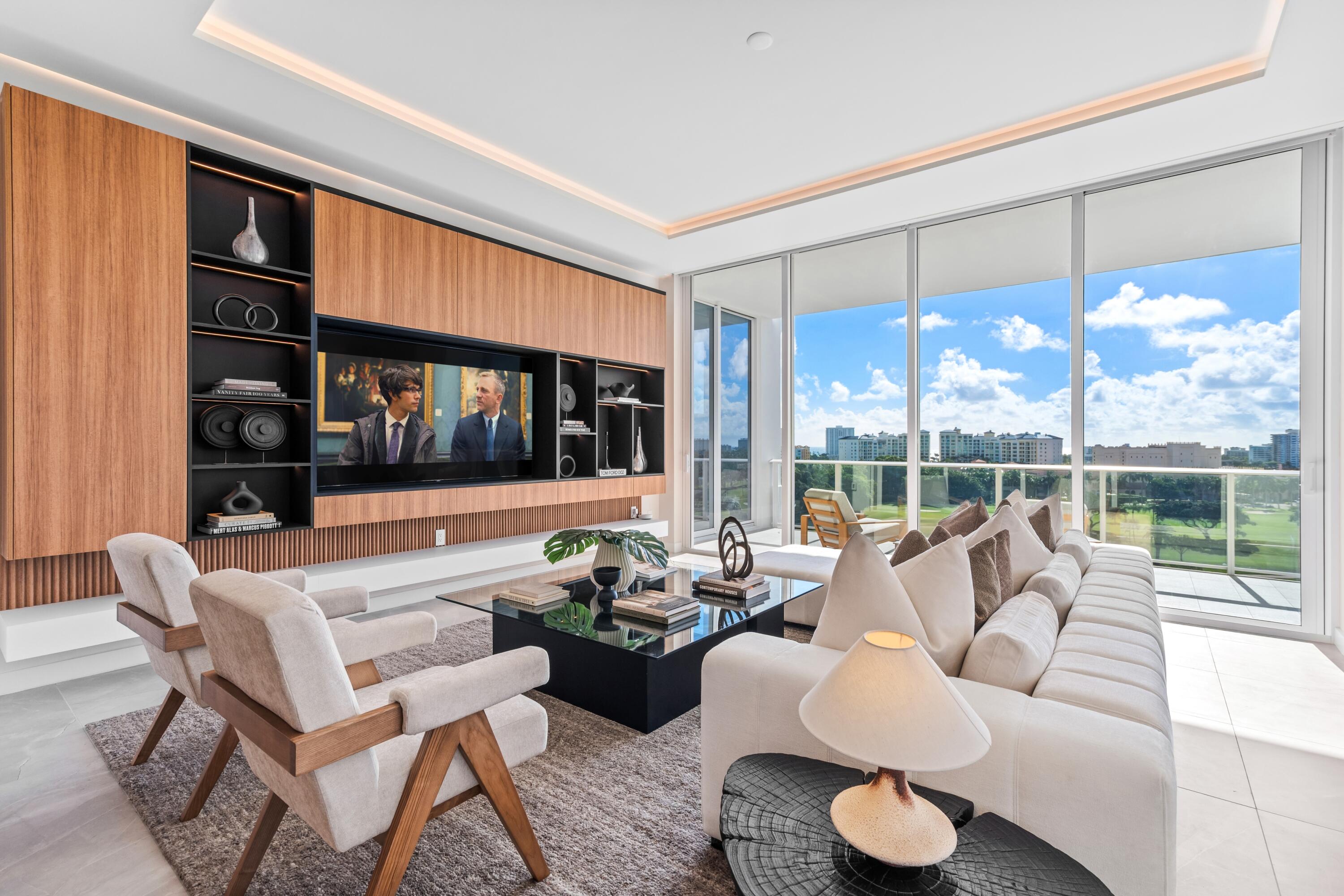220 Southeast Mizner Boulevard, Unit PH24 Boca Raton, FL 33432 - Photo 5 of 51 a living room with furniture and a large window