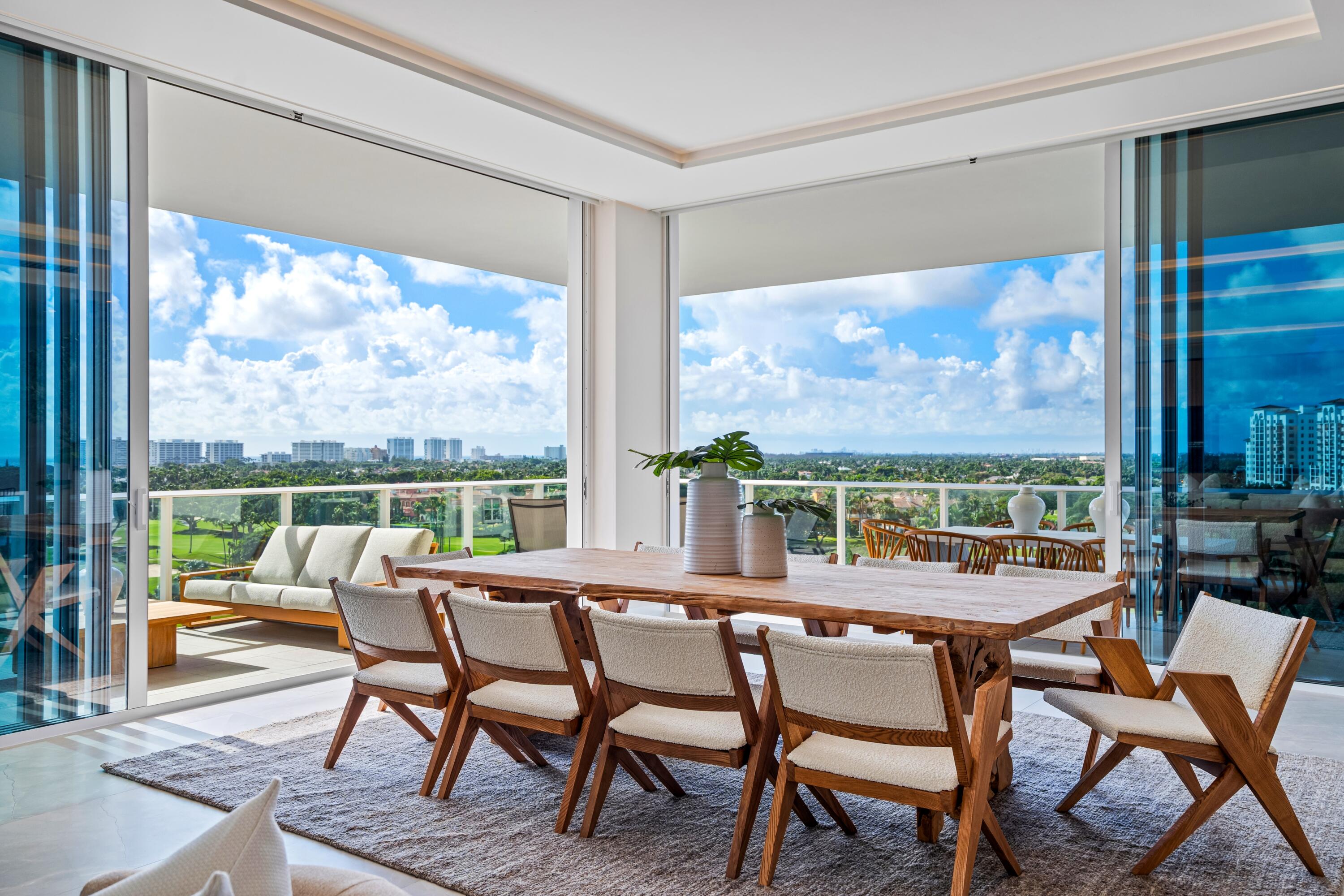 220 Southeast Mizner Boulevard, Unit PH24 Boca Raton, FL 33432 - Photo 7 of 51 a dining room with furniture a chandelier and outdoor view