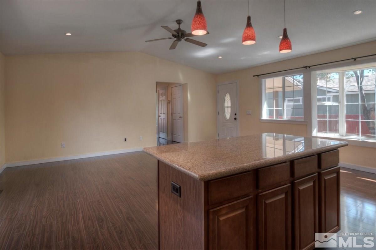 2975 Andrea Street Reno, NV 89503 - Photo 11 of 28 a kitchen with a sink and chandelier