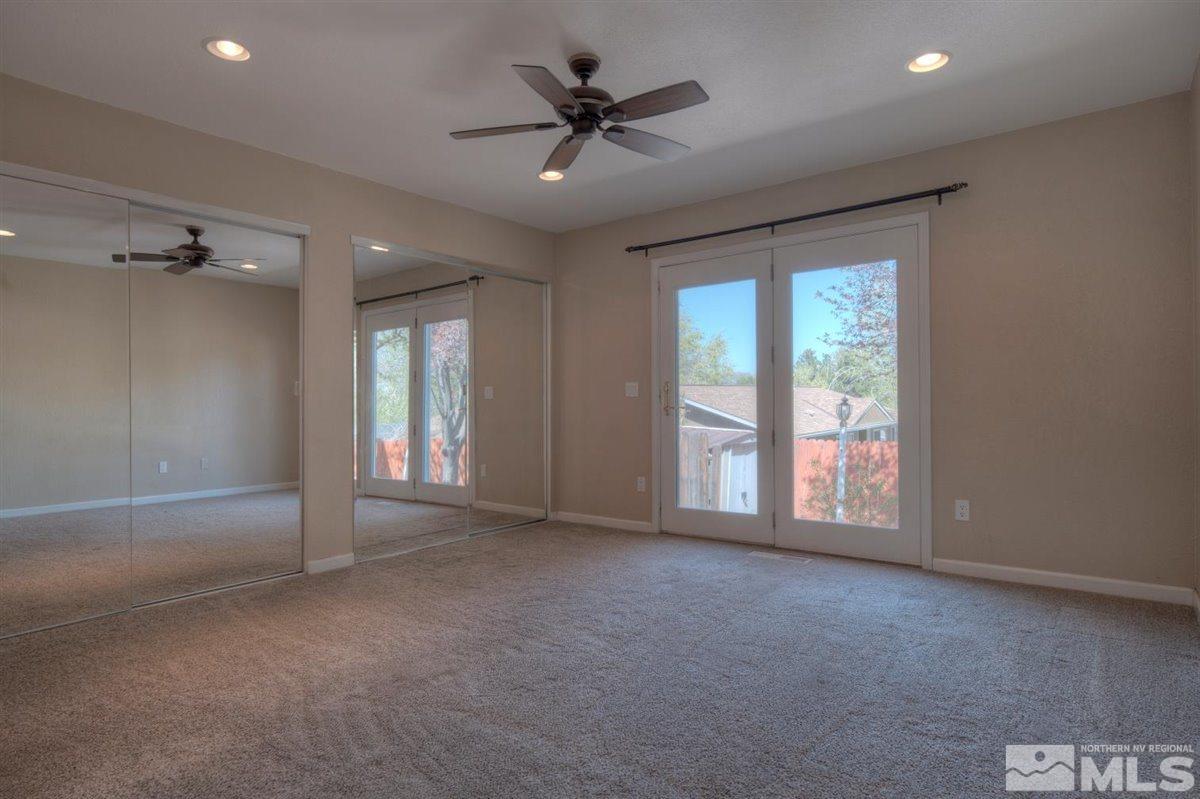 2975 Andrea Street Reno, NV 89503 - Photo 13 of 28 an empty room with windows and ceiling fan
