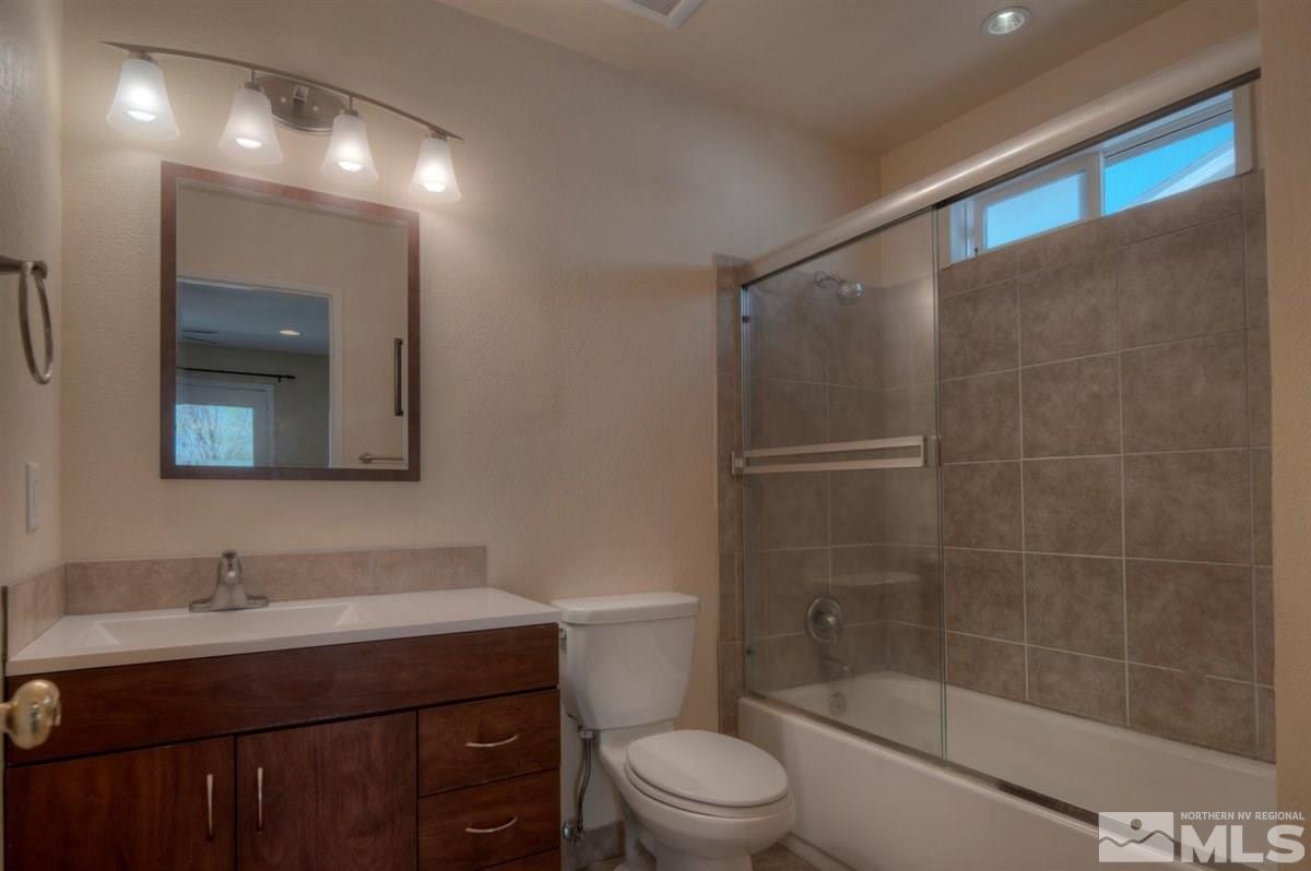 2975 Andrea Street Reno, NV 89503 - Photo 15 of 28 a bathroom with a sink a toilet and shower