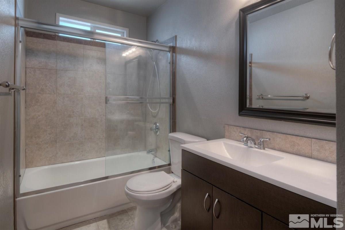 2975 Andrea Street Reno, NV 89503 - Photo 20 of 28 a bathroom with a sink a toilet and shower