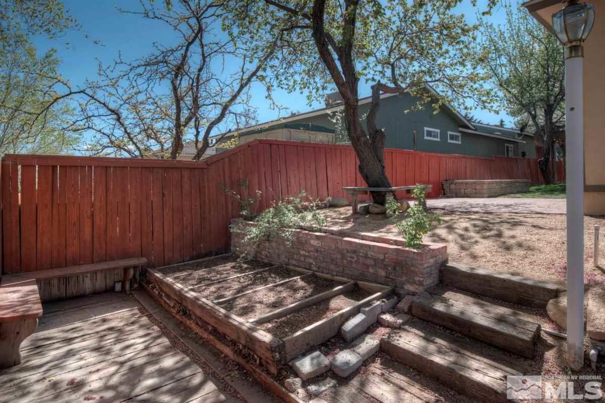 2975 Andrea Street Reno, NV 89503 - Photo 23 of 28 a view of a backyard with wooden fence