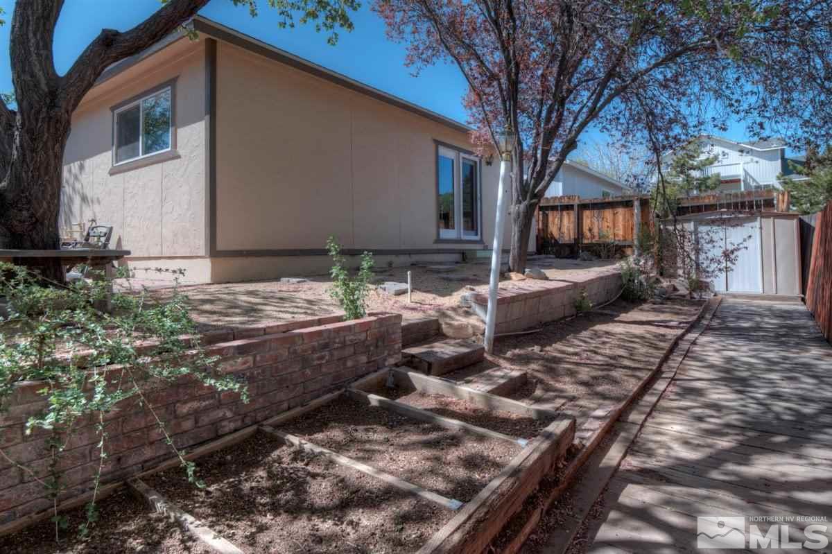 2975 Andrea Street Reno, NV 89503 - Photo 26 of 28 a view of a house with backyard and sitting area