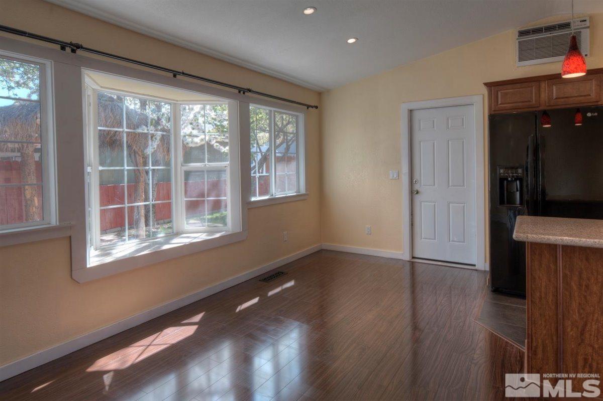 2975 Andrea Street Reno, NV 89503 - Photo 6 of 28 a view of an empty room with wooden floor and a window