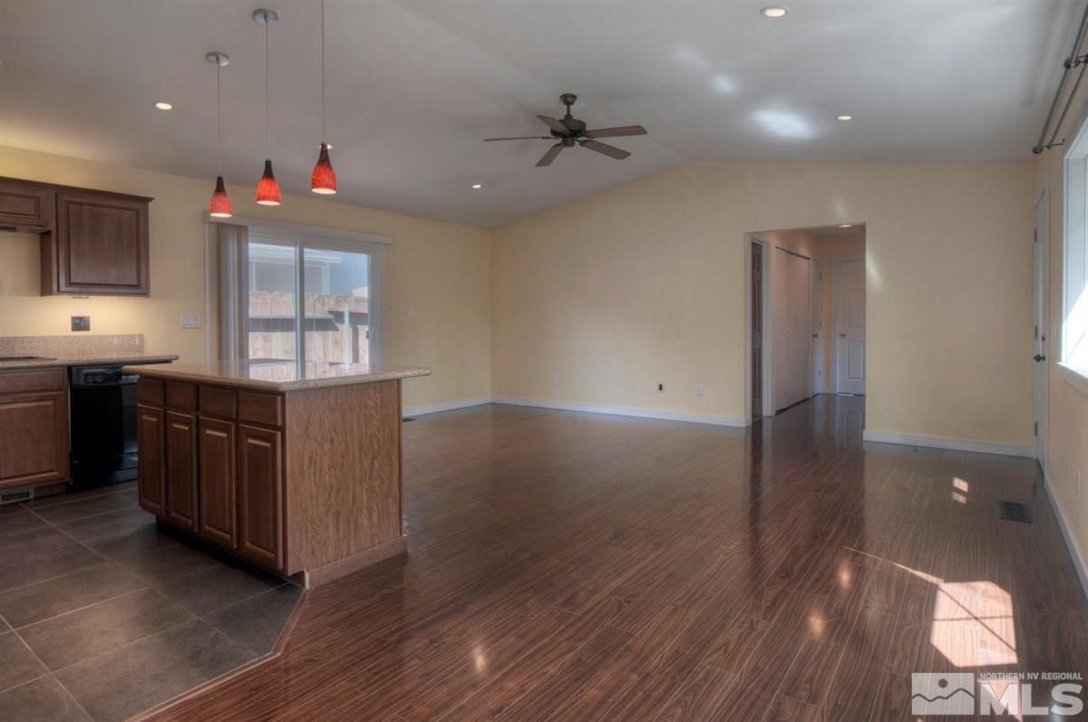 2975 Andrea Street Reno, NV 89503 - Photo 8 of 28 a kitchen with granite countertop a stove and a sink
