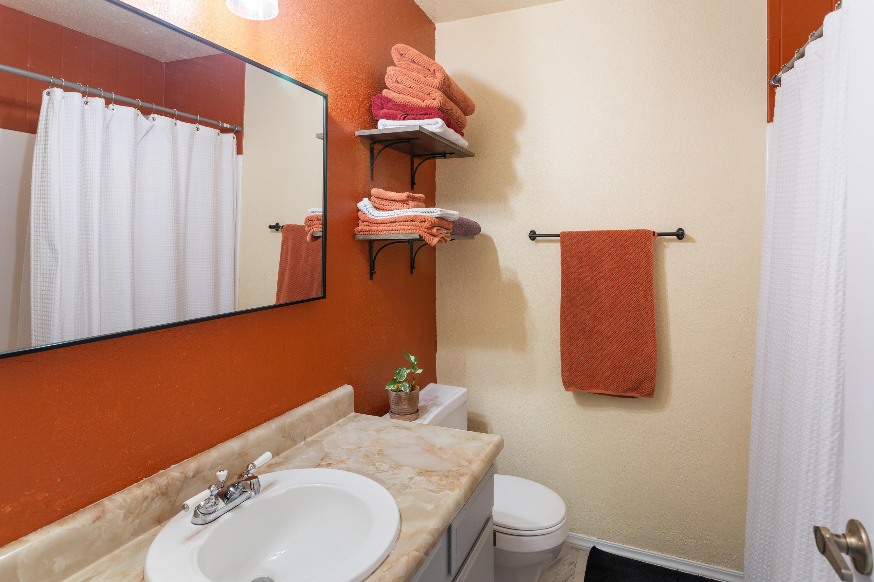 771 Flower Ash Lane Redding, CA 96003 - Photo 15 of 24 a bathroom with a sink toilet and vanity