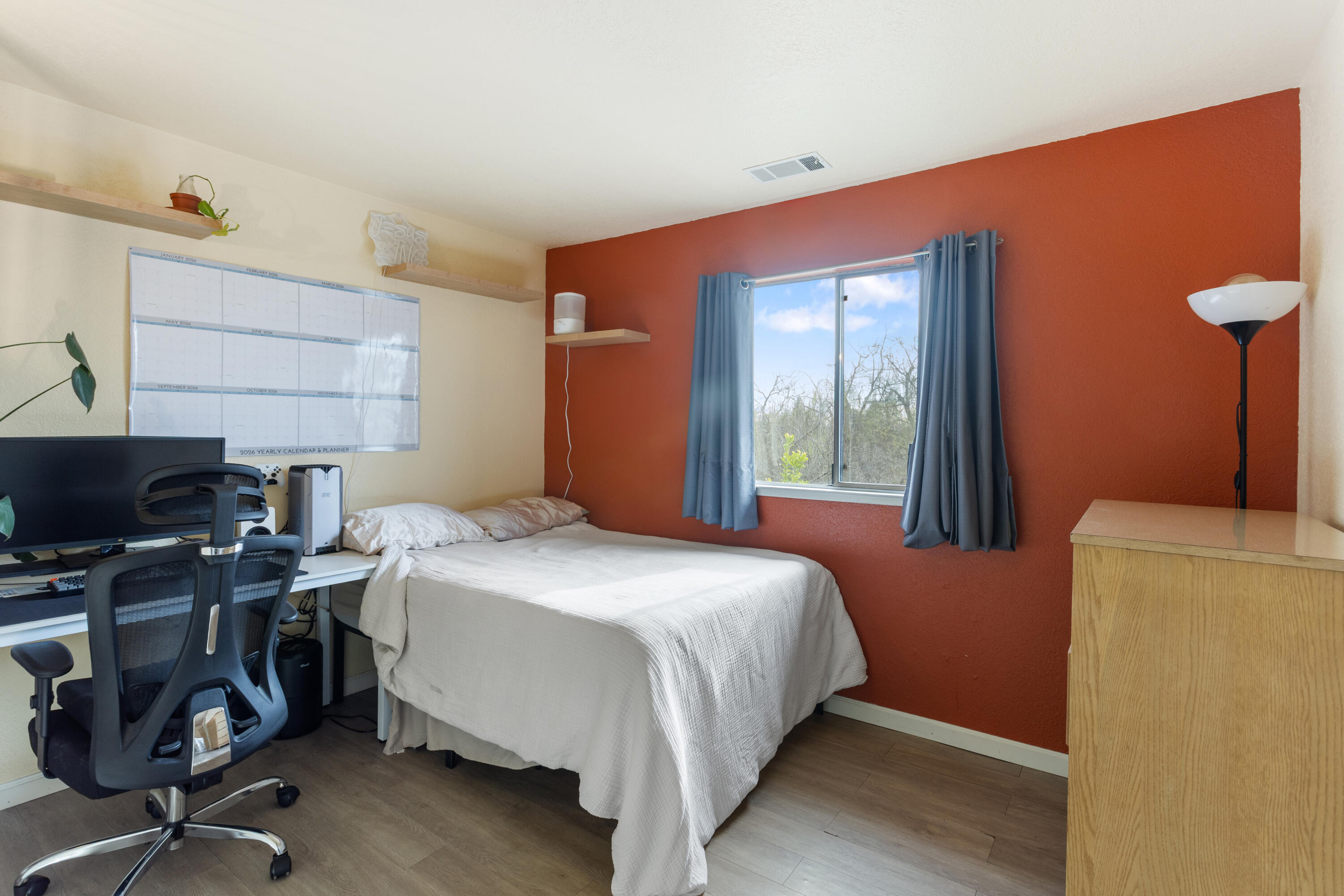 771 Flower Ash Lane Redding, CA 96003 - Photo 16 of 24 a bedroom with a bed and a desk