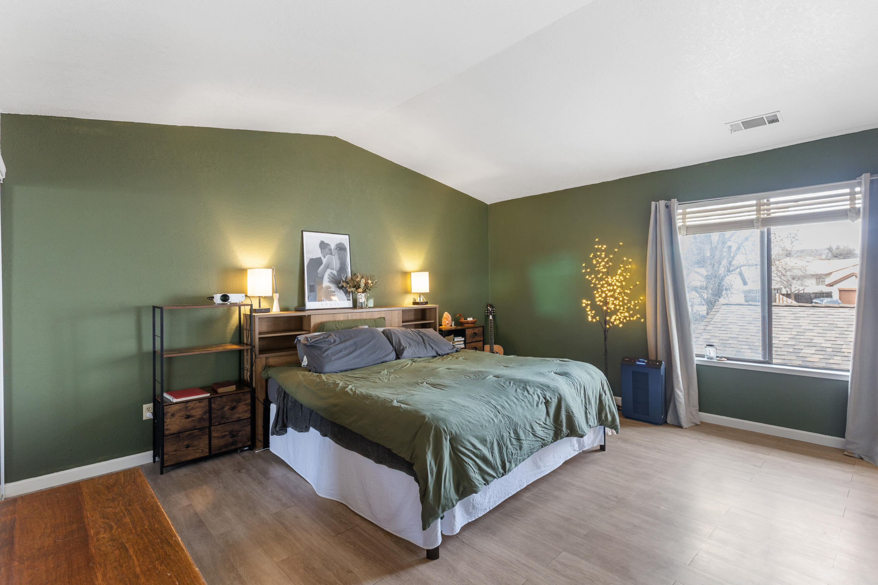 771 Flower Ash Lane Redding, CA 96003 - Photo 17 of 24 a spacious bedroom with a bed and window